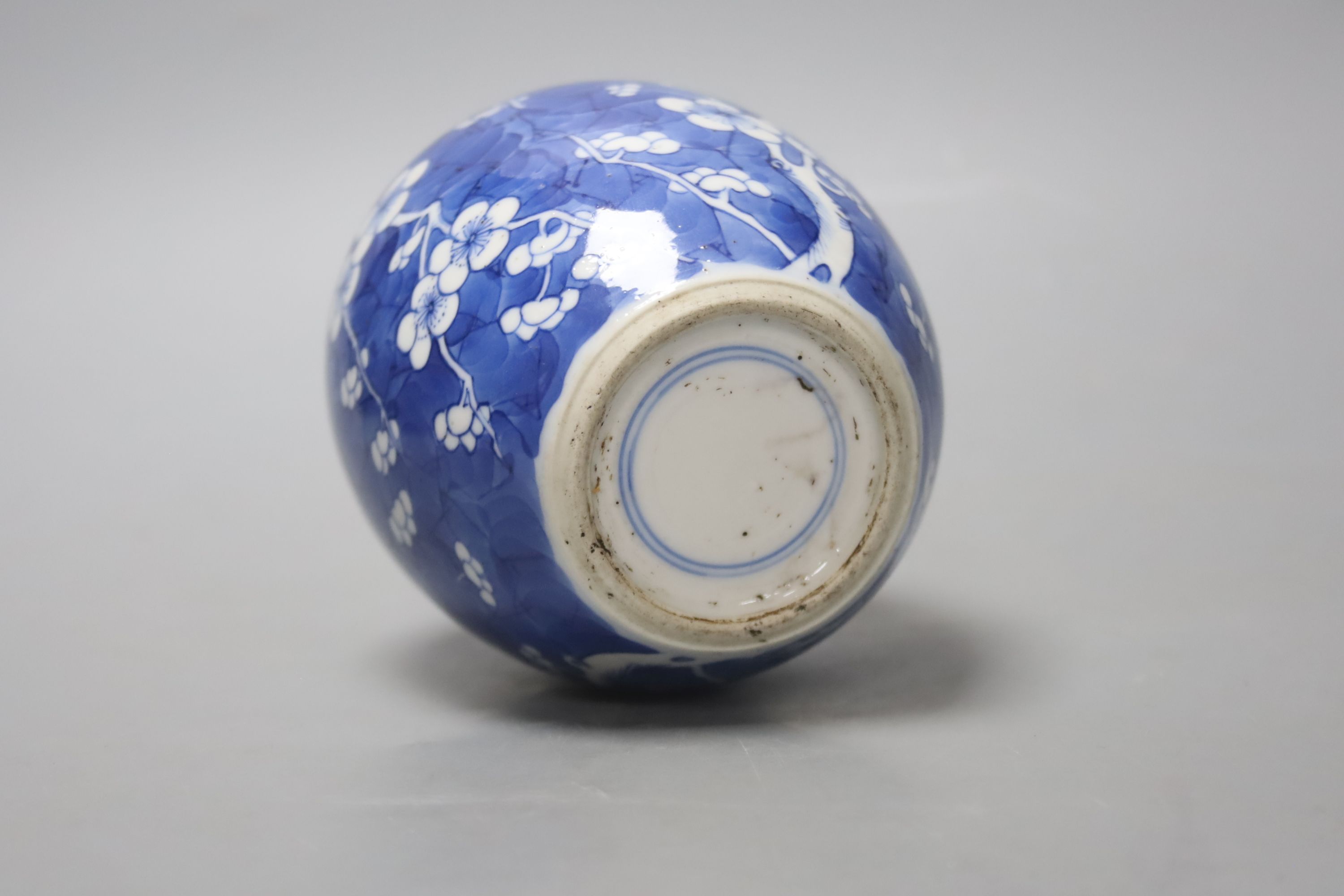 A Chinese Kangxi blue and white prunus jar, lacking cover, height 12cm